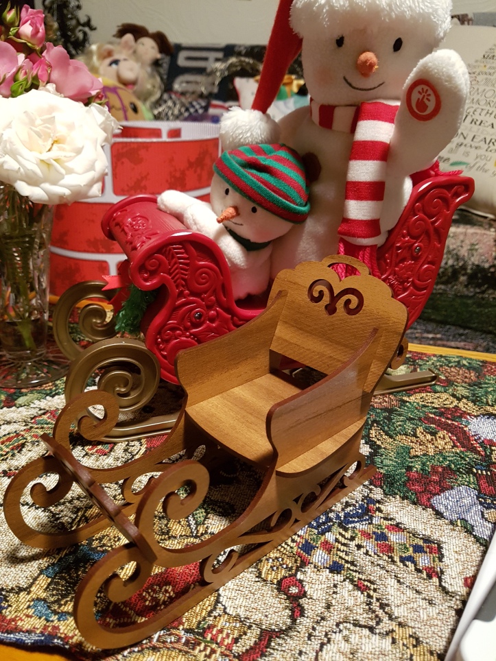 A large sleigh with a couple of snowmen (who sing) and a tasteful wooden sleigh made of wood